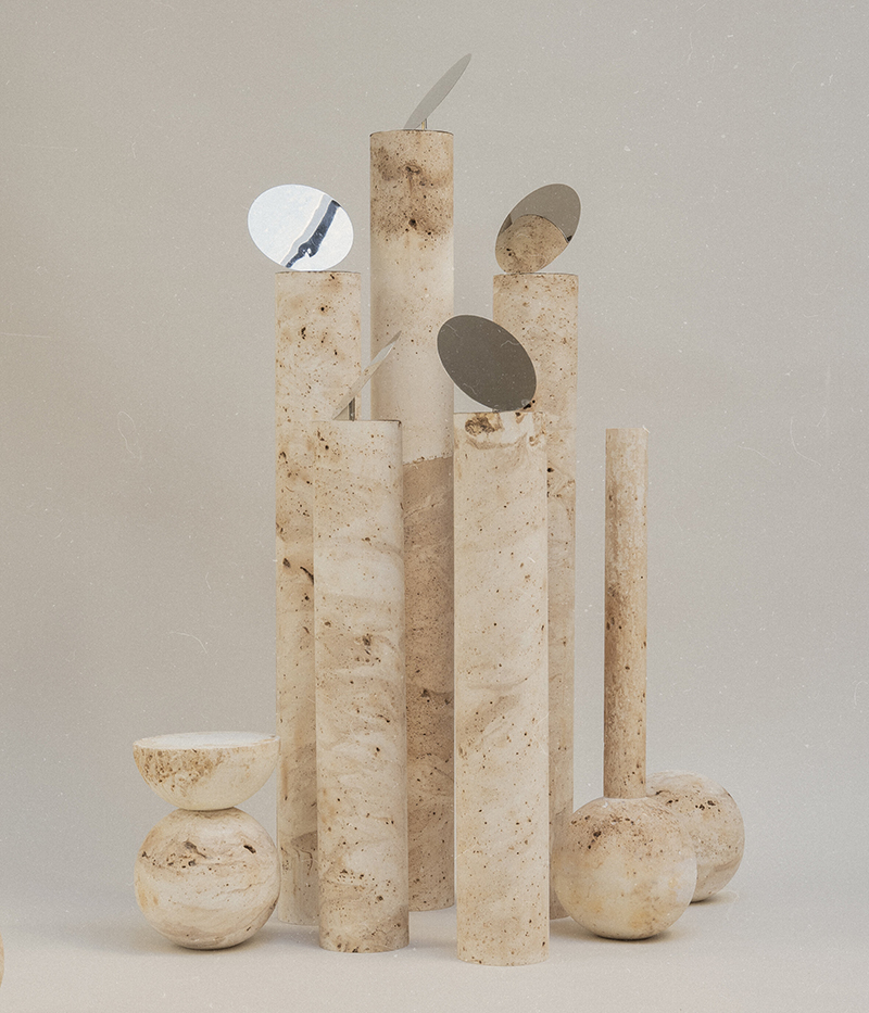 Turbina Estudio: Colección Satellite formada por tubos de piedra y espejos encima.