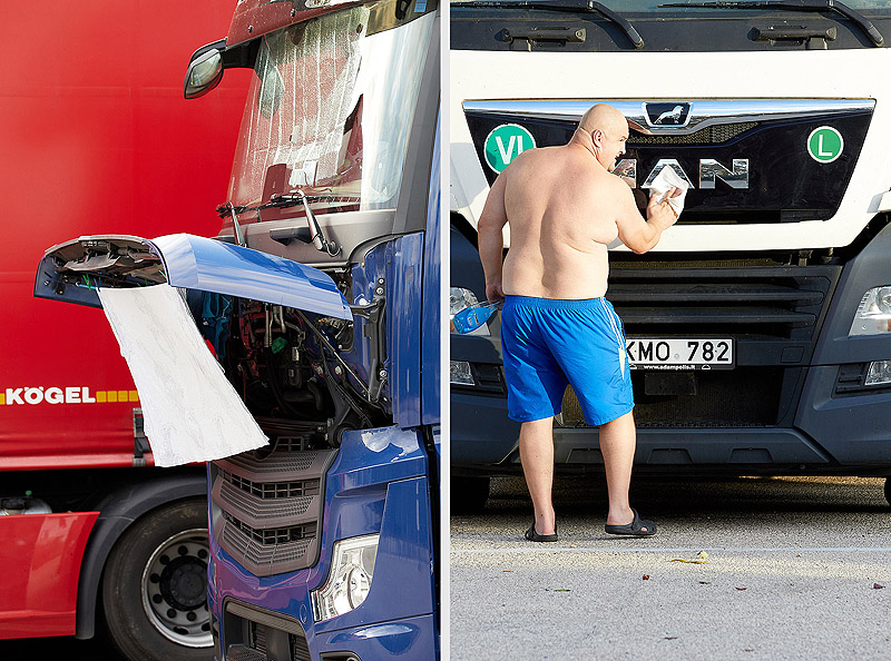 DOMENICA - foto de camionero haciendo mantenimiento en camión