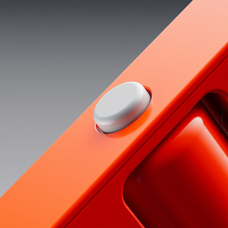 Rabbit R1: un dispositivo cuadrado de color naranja primer plano del único botón que tiene