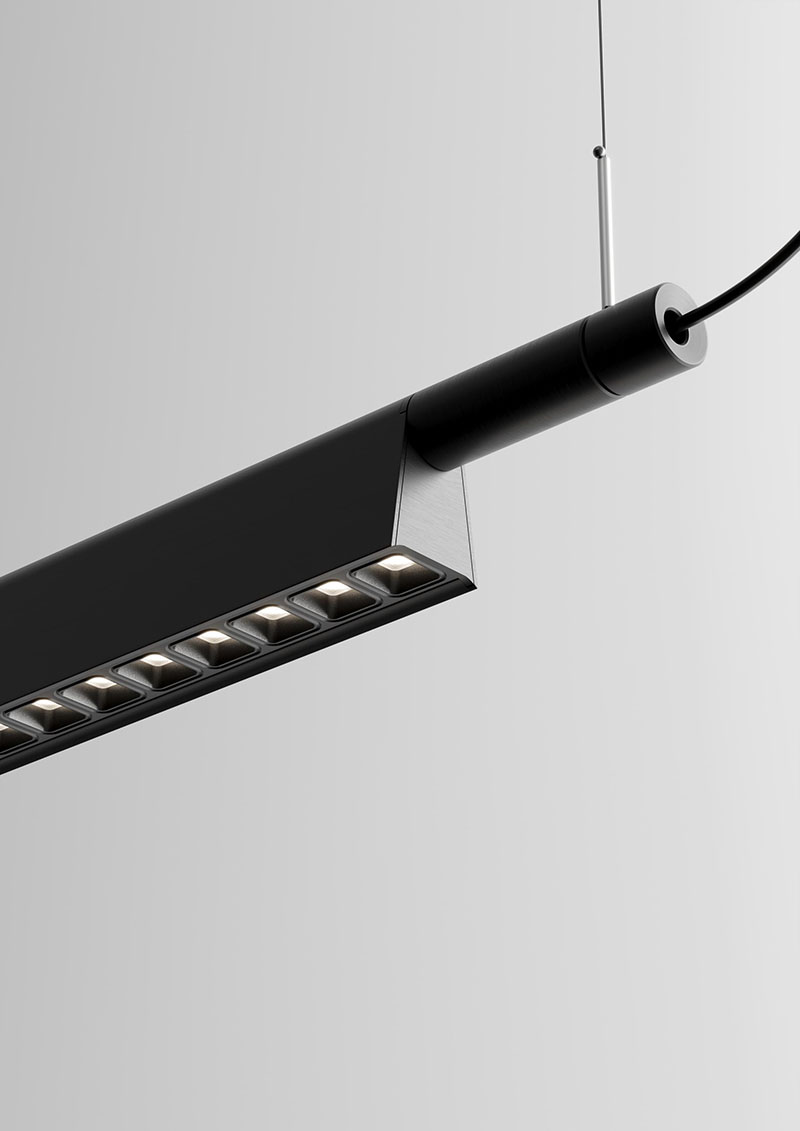 Compendium Suspension Luceplan: detalle de la lámpara Compendium Suspension de Luceplan en color negro sobre un fondo blanco neutro.