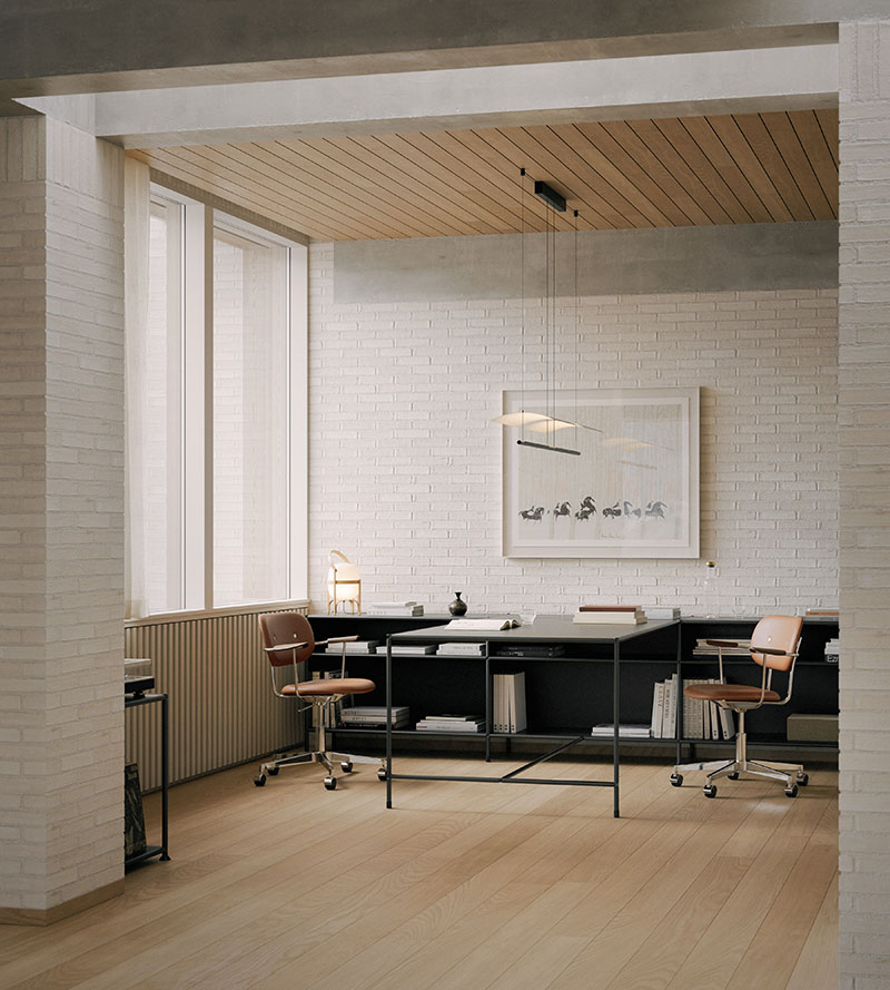 Doi emplea el sistema D1 como mesa de trabajo en un estudio con paredes de ladrillo blanco