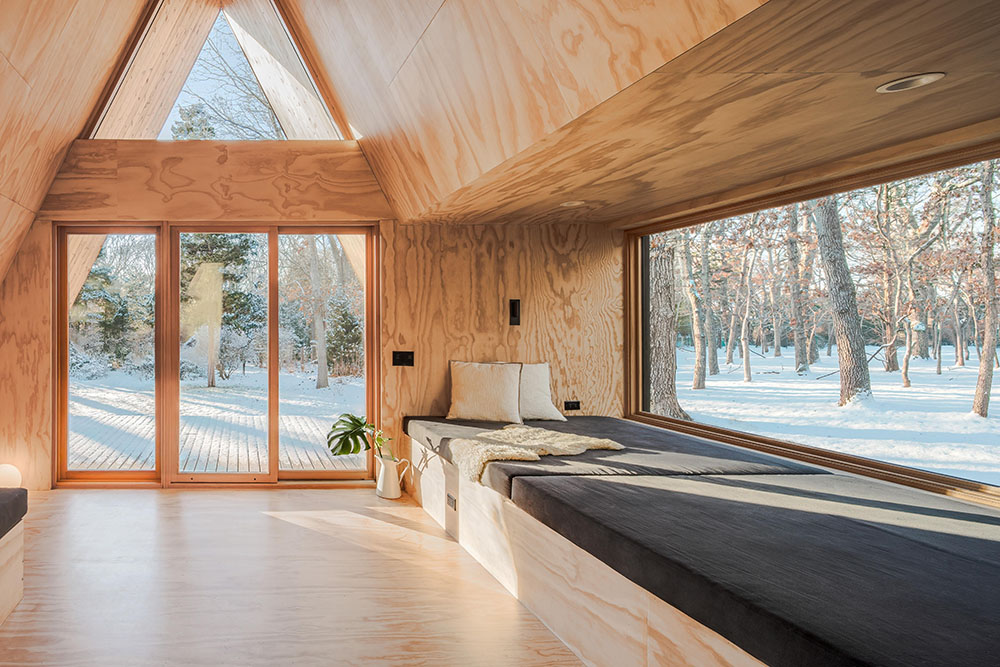 La cabaña de madera de BE_Design para retiros de bienestar