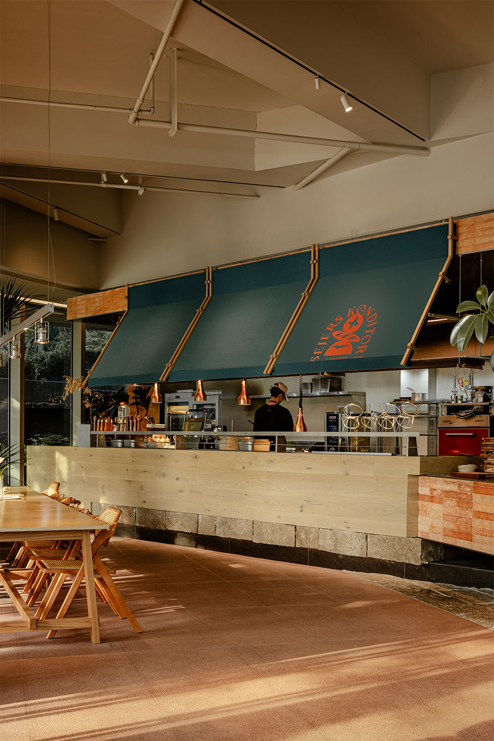 WJ Studio abre la cocina de una panadería-restaurante